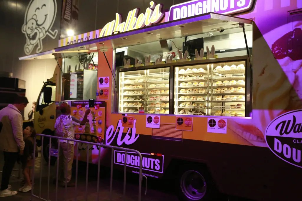 Walker's Doughnuts food truck serving fresh Doughnuts at an evening event